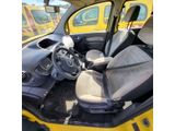 a small yellow car with a steering wheel in the back of it