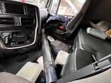 a view of the inside of a car from the driver ' s seat