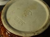 a close up of a vase on a table