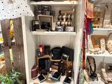 a small closet with a lot of items on the shelves