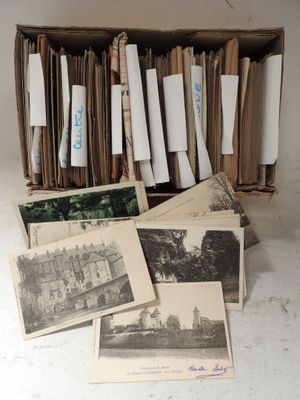 a lot of old photos in a box on the table