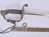 two old swords that are laying on a white surface