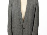 an image of a suit on a mannequin stand