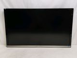 a large flat screen tv sitting on top of a white surface
