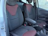 a car that has two seats in it and a steering wheel