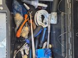 a black case with tools inside of it on the floor