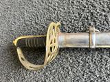a close up of a sword on a carpet