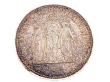 une image représentant une pièce de monnaie sur laquelle figurent un homme et une femme