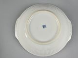 a white plate with a blue and white design on it