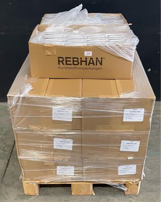 boxes of rebiann are stacked on a pallet in front of a black wall