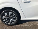 a white car that is parked in the parking lot