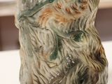 a ceramic bear that is sitting on a table