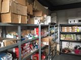 many boxes and boxes on the shelves in the room