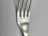 a fork that is sitting on top of a plate