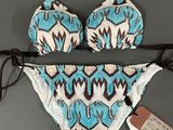 a bathing suit with a blue and white pattern on it