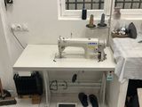 an image of a sewing machine in a small room