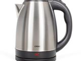 the electric kettle is sitting on a white surface
