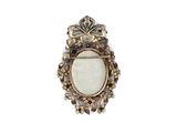 a close up of a broochle with a white stone in it