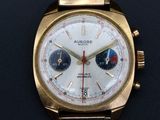 an image of a gold watch with a white dial