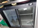 an image of a glass door freezer in a kitchen