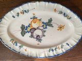 a plate with a bird and a flower design on it