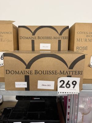 a pile of boxes on a table with a price tag on it
