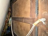 a hand that is holding a rope in front of a chest