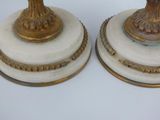 two candles that are sitting on top of each other