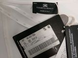 a white shirt with a black label on it