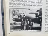 an old picture of a group of men standing in front of a plane