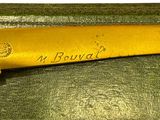a baseball bat that is laying on top of a box