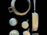 an image of a collection of silver objects on a black background