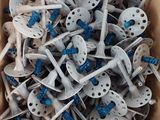 a cardboard box filled with lots of white and blue screws