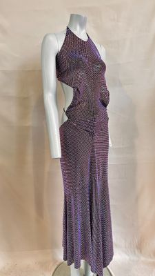 the mannequin is wearing a purple dress on a white mannequin