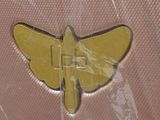 a small yellow butterfly on a pink plastic bag