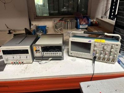 many electronics sitting on a table in a room