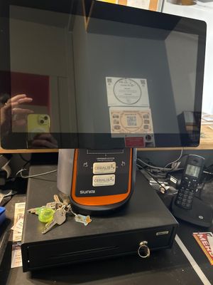 someone is taking a picture of a tablet computer on a desk