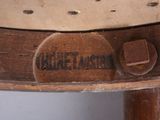 a close up of a wooden table with a sign on it