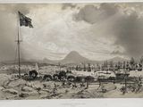 an old picture of a view of a town in the middle of the day