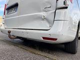 a white van that is parked on the side of the road