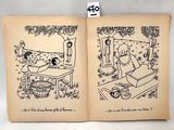 un livre ouvert sur lequel figure le dessin d'un homme et d'une femme dans un lit