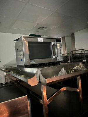 a microwave sitting on top of a counter in a kitchen