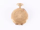 pocket watch on a white surface with a white background