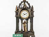 a statue of a woman holding a green card next to a clock