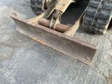 a bulldozer that is sitting on the ground