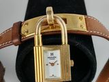 an image of a close up of a wrist watch with a padlock on it