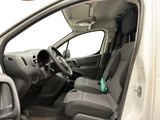 the interior of a car with the door open and the driver ' s seat down