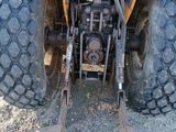 a tractor that is parked on the side of the road
