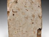 a stone block with a small hole in the middle of it