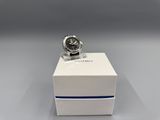 a close up of a watch in a box on a table